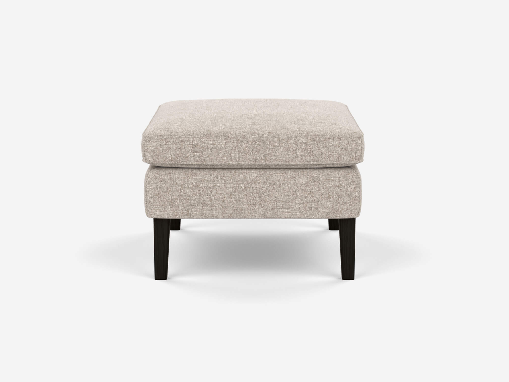 Side view of the Skye mid century ottoman in beige fabric